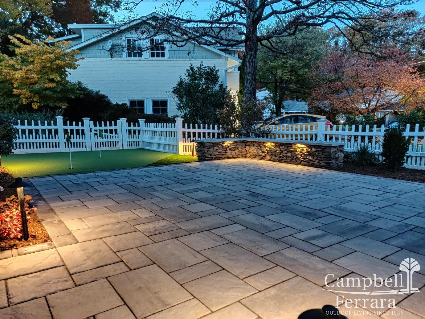 Landscape lighting by shrubs